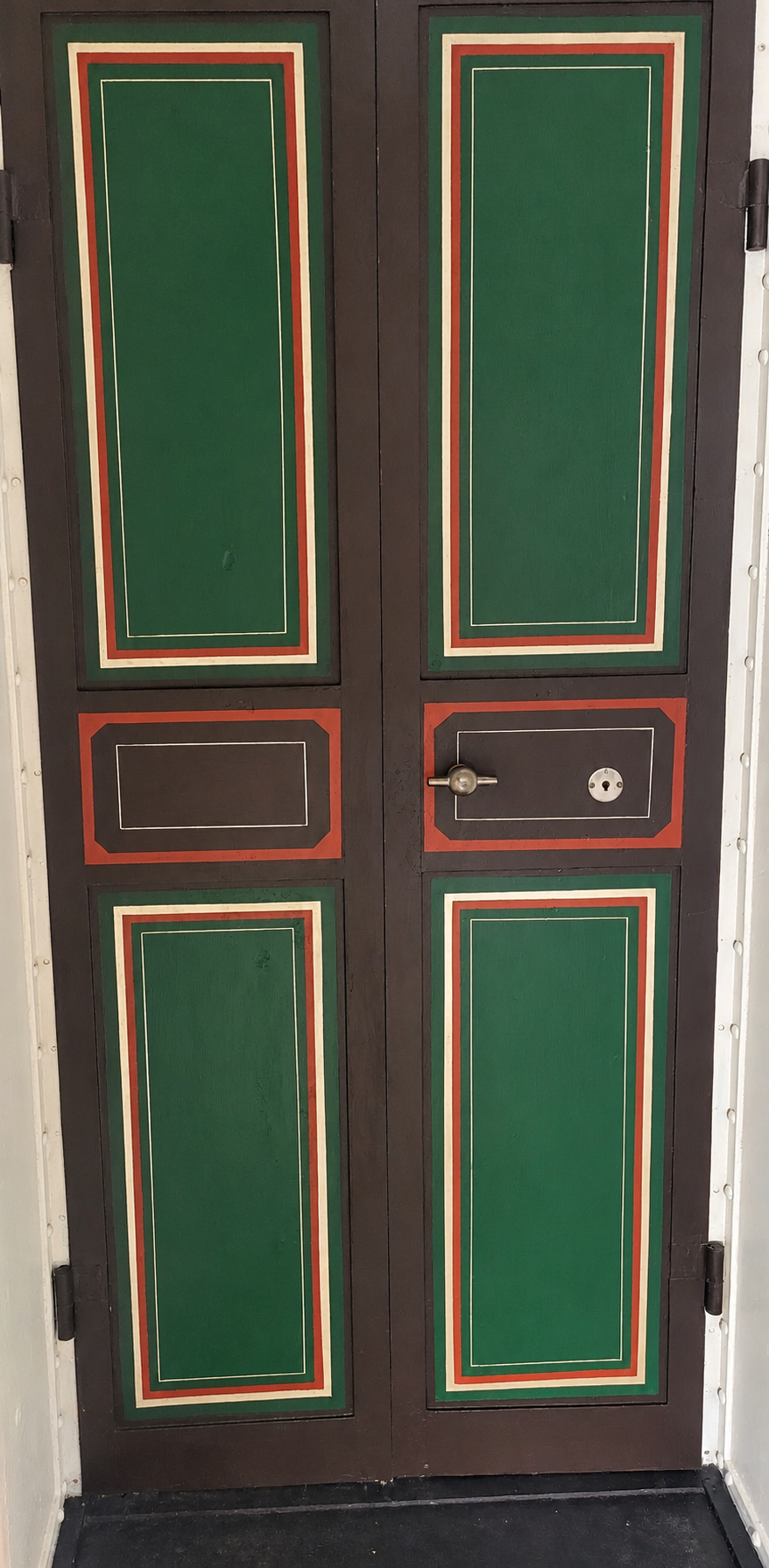 Paired inner doors and decorative interior surfaces of the Hall's vault assembly.